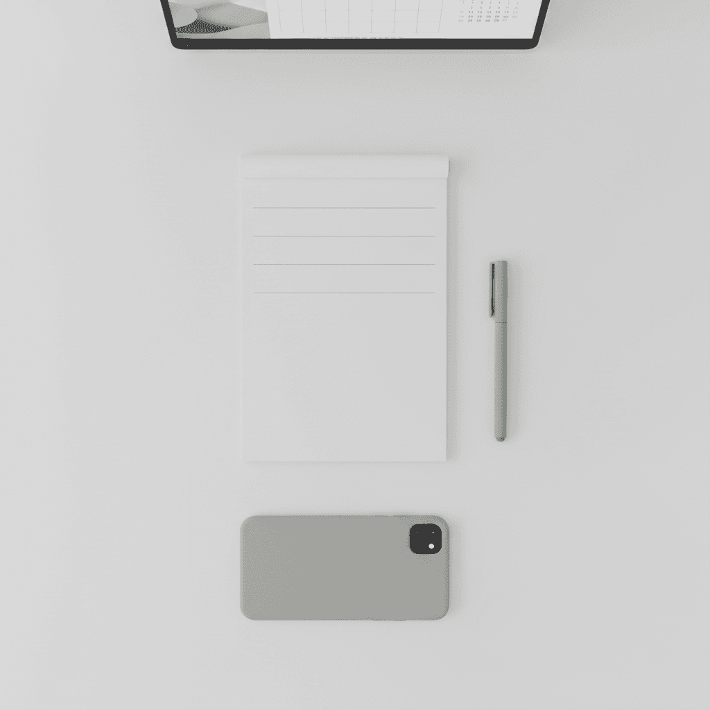 Minimalist desk with a to-do list and pen